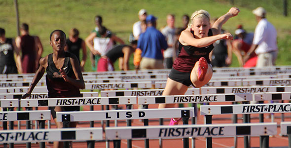 Varsity girls win district track meet, 21 athletes advance to area