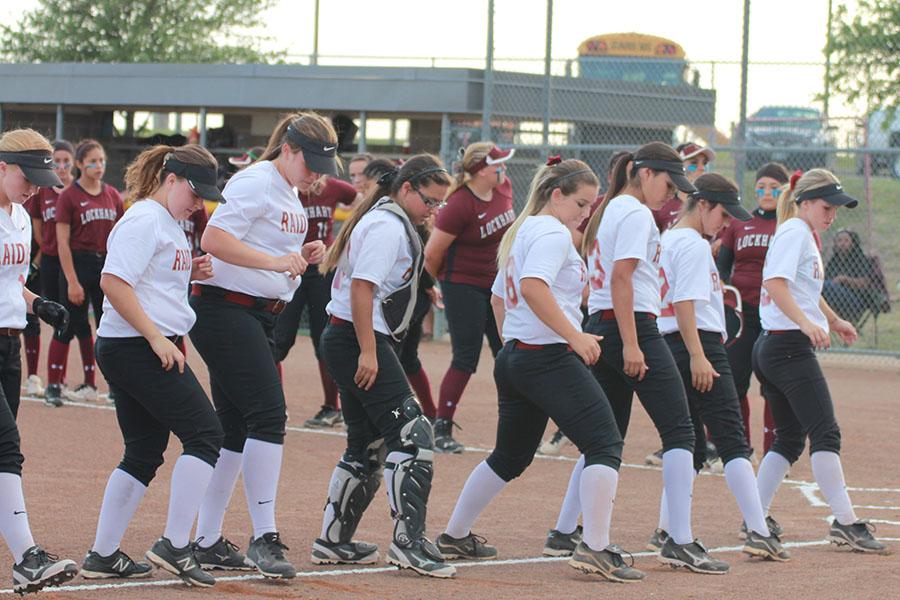 The varsity girls take the field before the Lockhart playoff game. They won the second round game 13-5.