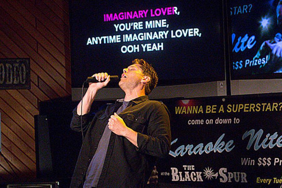 Dean Winchester, who is a demon in season 10, spends quite a bit of time singing bad karaoke in the first episode.