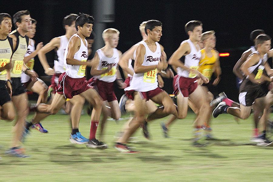 The varsity boys team takes off at the start of the Westlake Under the Light meet, Friday, Oct. 10. Mora (812) won the race.