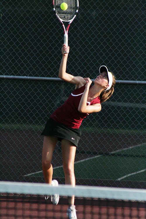 Brooke McKinnon serves during the Round Rock district match. McKinnons match was the deciding on against Pflugerville that helped the Raiders qualify for area.