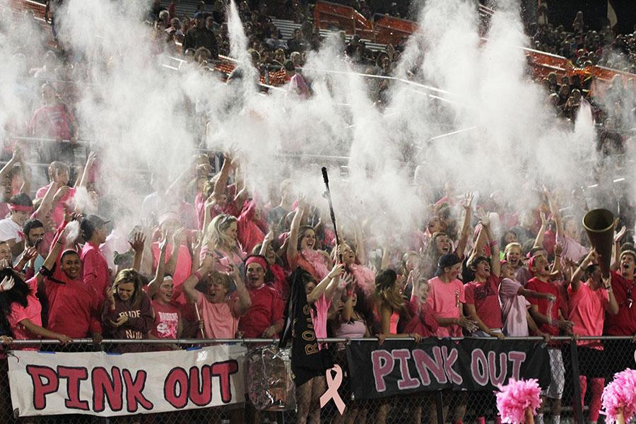 During the varsity footballs game against McNeil, the student section throws up Kool-Aid powder. The McNeil game was the Pink Out game, with students wearing pink in honor of Breast Cancer Awareness Month.