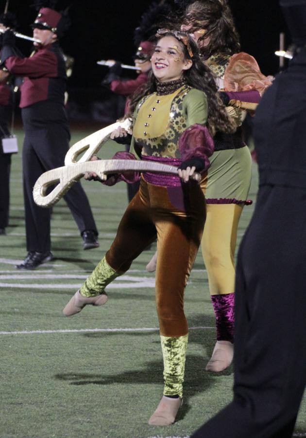 Angelica Culver performs with the color guard at the Round Rock game.
