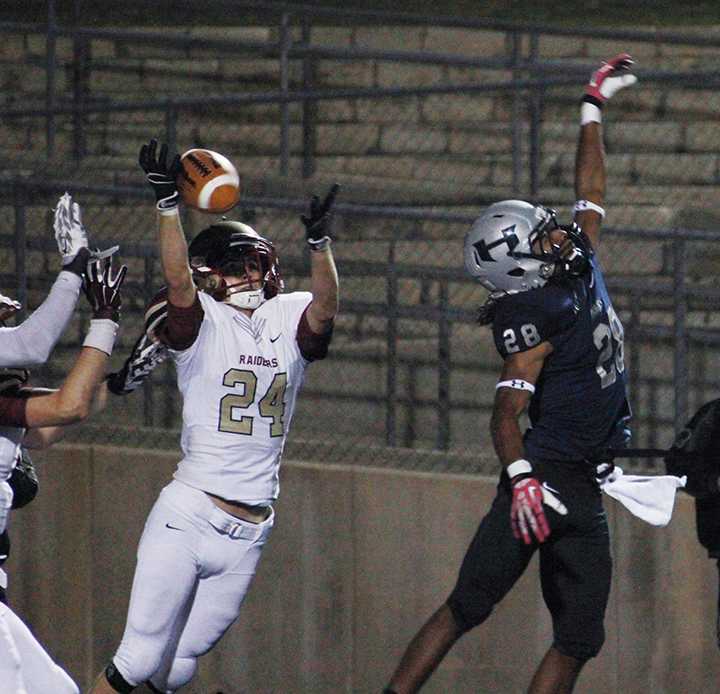 On the final play of the Hendrickson game, sophomore Jackson Franks tries to hold on to the end zone catch.