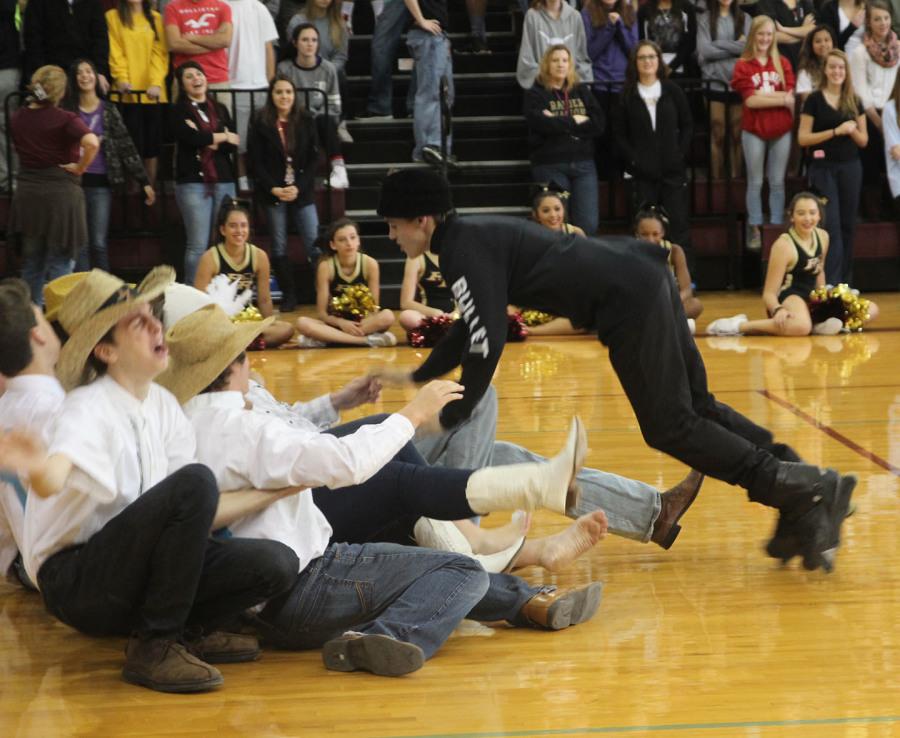 Junior Brian Robinson, playing the bullet, runs into the Hawks during Theatres skit.