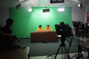 Nick Hickam and John West prepare to anchor the daily broadcast. RNN films every day for the next day's show.