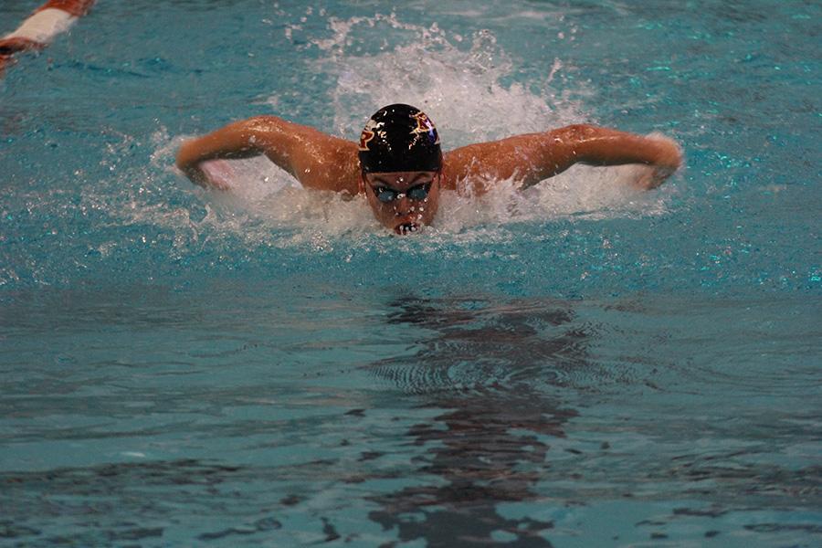 Pablo Rodriguez competes in the first day of district, Jan. 23. Rodriguez finished 6th in the 100 Fly and qualified for regionals.