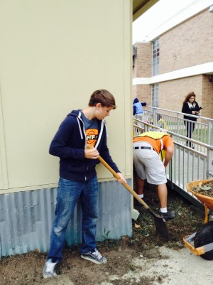 Sophomore Joshua Sanders volunteers with the Woolridge Elementary cleanup