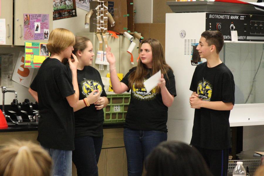 Matthew Moller, Lexi Johnson, Emily Mask and Bryce Newman compete at the Destination Imagination regional competition at Hendrickson High School. The team finished third in the Improv Challenge.