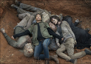 Sasha lies in a grave with walkers she killed.
