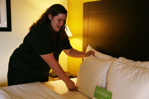 Serina Stetar makes a bed at La Quinta. "Hospitality really opened my eyes to working on a professional level," Stetar said. "We learned how to inspect each hotel room so it looks like nobody has ever been there. I feel really confident in the business now."