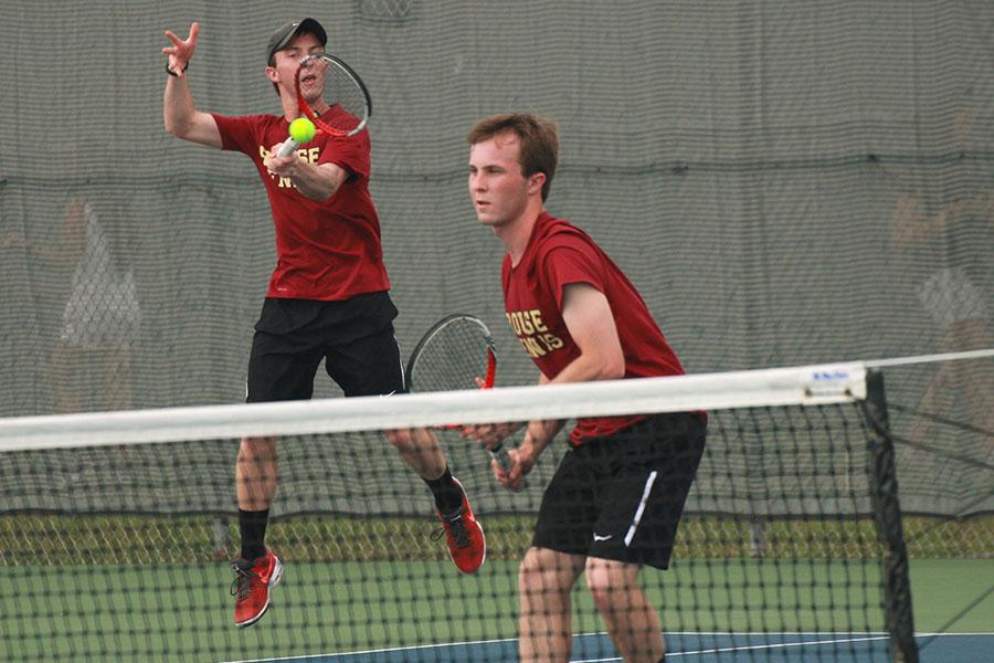 In the district final, Dylan Ritter returns the serve while Zane plays the net. The Ritters won the match over Westwood in three sets to win the district championship.