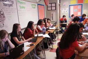 Students use a portable lab during Lauren Murphy's Physics seventh period class.