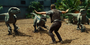 Chris Pratt faces off with velociraptors in Jurassic World.