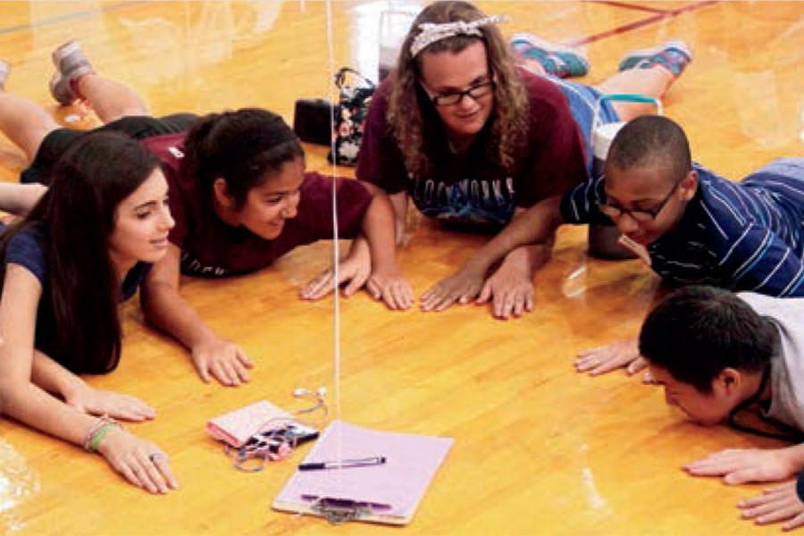 Members of the Class of 2018 play a game in the gym during the 2014 Raider Camp.