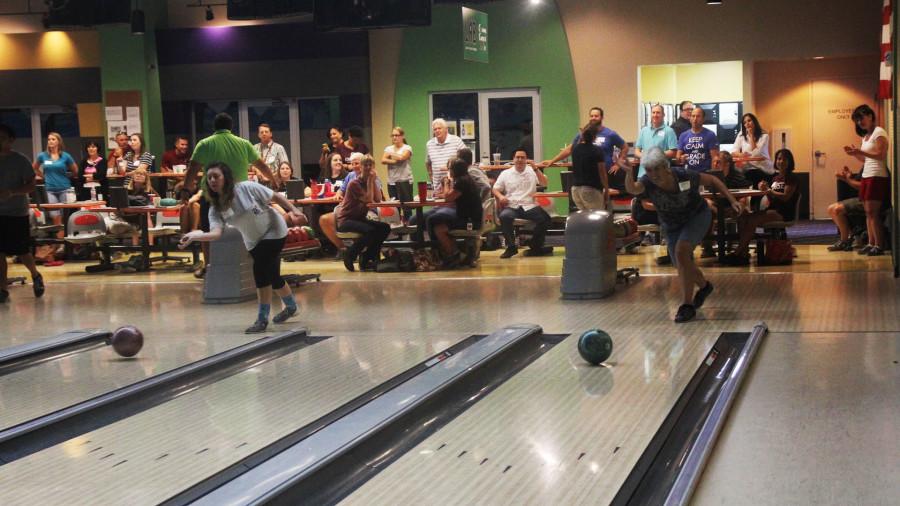 Rosie Palazzolo (left) and Karen Pearce bowl at Mels Lone Star Lanes in Georgetown. The entire faculty and staff traveled to the bowling alley for team building on the first day of professional development.