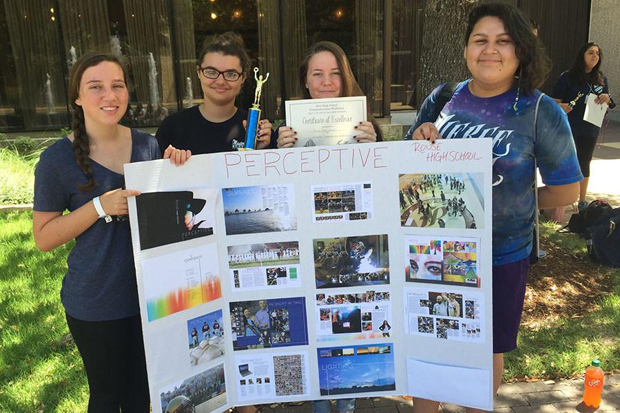 Staffers Chloe Hatfield, Kelsey Staber, Haley Moser and Jaci Chavera hold their presentation board. The staff won an Award of Excellence for Typography and Graphics.