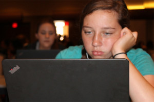 Yearbook staffer Chloe Hatfield works on a spread during lab at the Balfour yearbook camp at Texas A&M.
