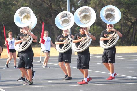 The band does double duty in the fall - prepping for halftime shows and rehearsing for their marching competitions.