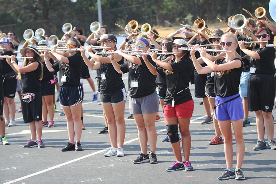 In the August heat, the band rehearses afterschool. This years marching show theme is Fragile which the band will perform at Festival of Bands and October competitions. 