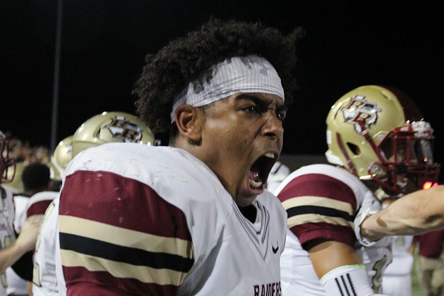Tyler Morris gets fired up on the sidelines of the Rouse Cedar Park game.