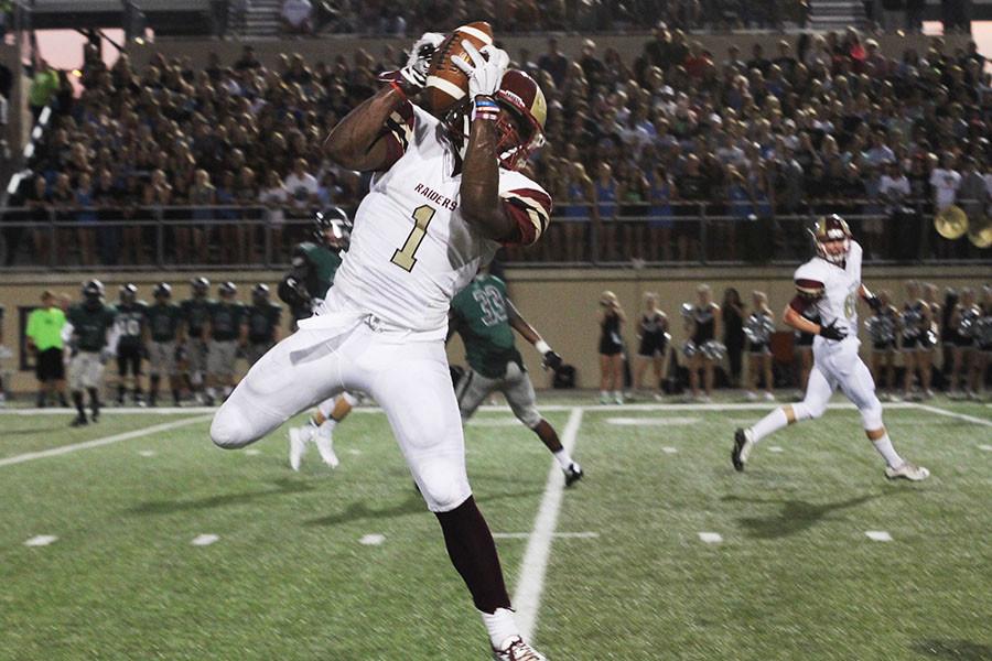 Marquis Simmons hauls in the catch in the first half of the Raiders loss to Cedar Park. Simmons had three catches for 22 yards and rushed for 115 yards.