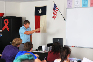 Professional Communications teacher Luke Harrison leads class during third period.