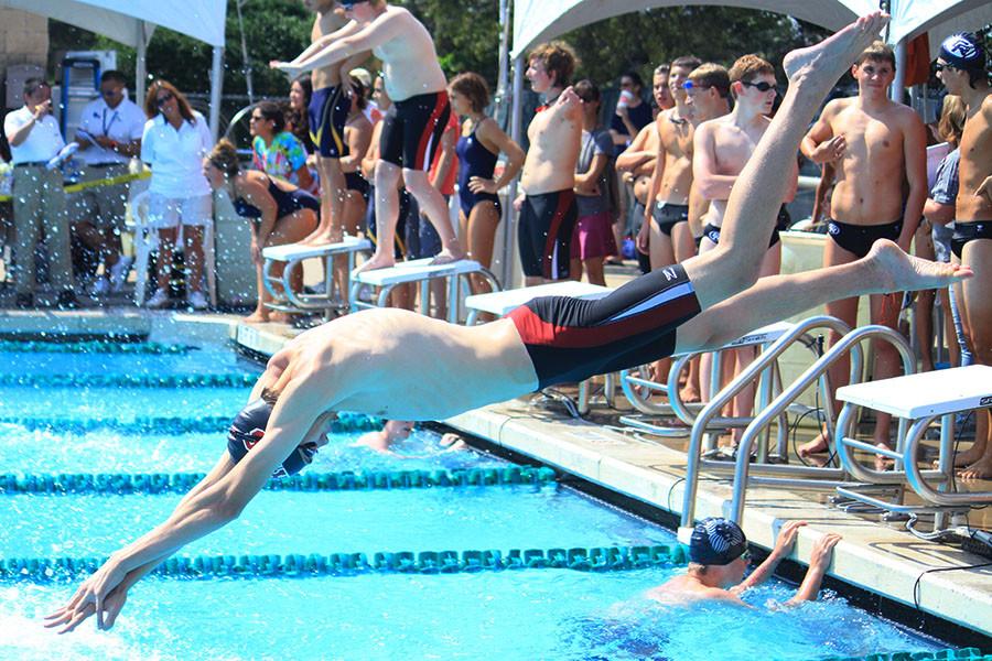 Jacob Gwin dive into the pool for the swims second meet, Sept. 24
