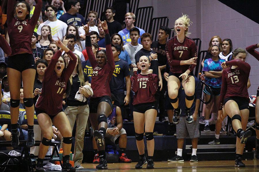 The bench reacts to winning a point in the Stony Point match.