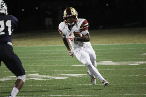 Senior Marquis Simmons runs the ball during the McNeil game.