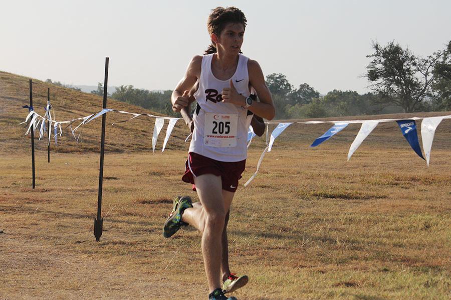 Junior James Tisdale runs the varsity boys race. Tisdale finished 10th and advances to regionals.