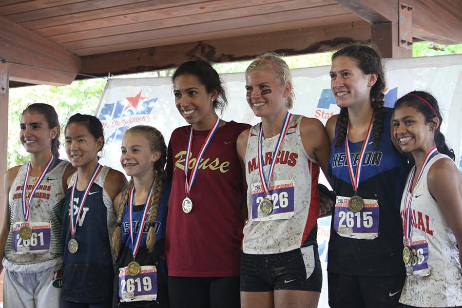 Senior Madie Boreman (in maroon) stands with the other medalists at the 6A state meet.