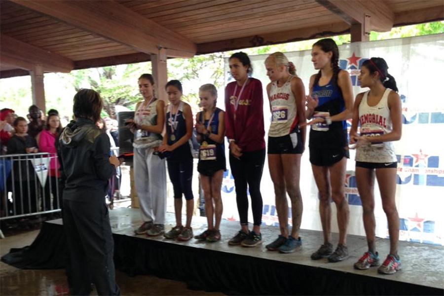 The finishers, including Madie Boreman (center in maroon) receive their medals.