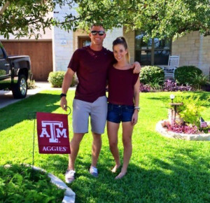 Luke Cannon and his girlfriend with the A&M flag.