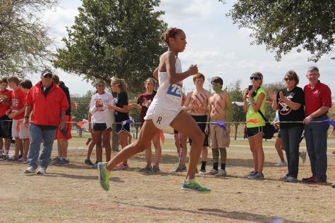 Madie Boreman heads for the finish line at the 2012 5A cross country state race. 