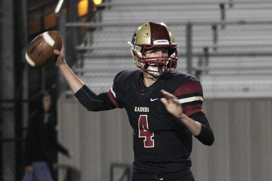 Quarterback Michael Forster looks for an open receiver in the Hendrickson game.
