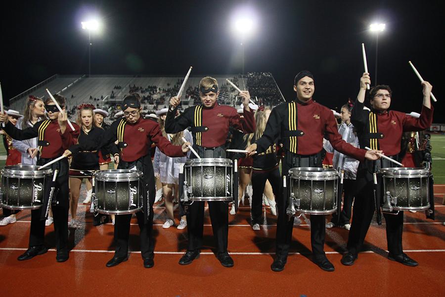 The drumline plays during the third quarter.