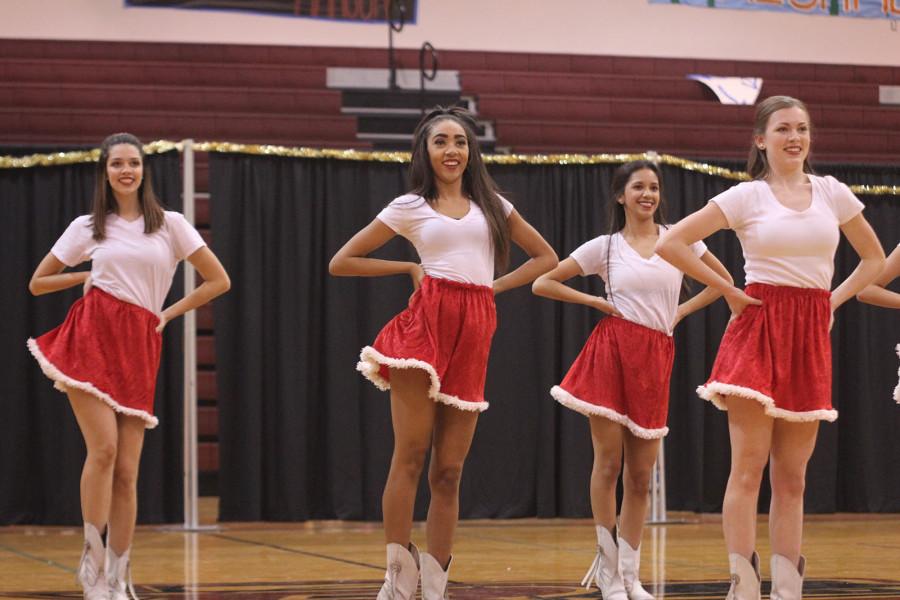 The Royals dance in the small gym at their show.