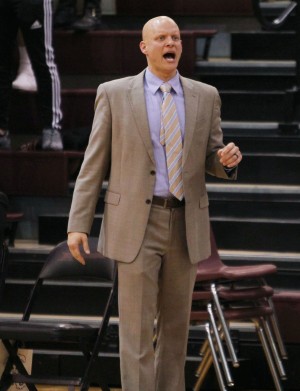 Coach Shane Krause yells on the sideline during the Westwood game.