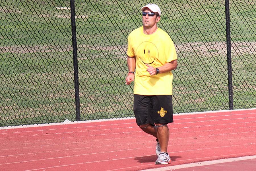 US History teacher Michael Hjort runs around the track on Feb. 29, 2012. Hjort ran a marathon that day to raise money for a charity. Four years later, hes running another Leap Day marathon to raise funds for Project Grad.