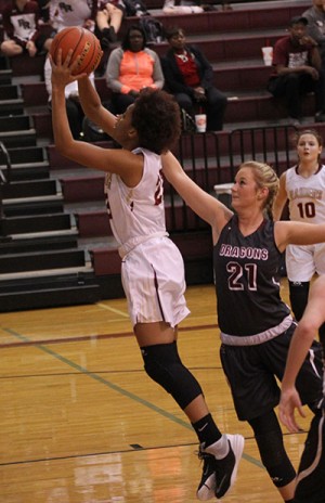 Junior Zoe Holmes goes up for a layup in the Round Rock game.