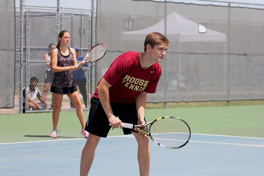 Sophomore Cherokee Ford and junior Cameron Dalman play mixed doubles at the district tournament.