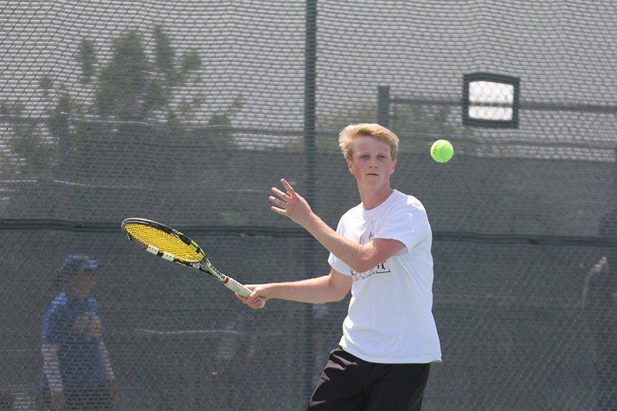 Senior+Bryson+King+returns+the+ball+during+a+match+at+the+district+tournament.+King+finished+fourth+in+boys+singles.