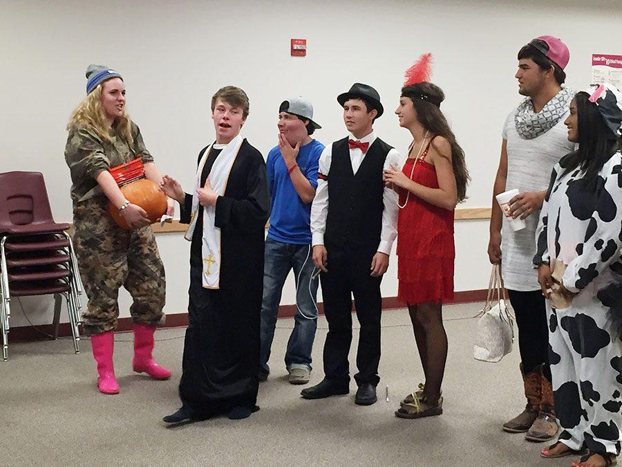 Meagan Hammond, Luke Sackett, Clay Pennington, Caleb Wilson and Jenna Hage line up for the costume contest at the Halloween party. Sackett and Katie Hebdon dressed as a priest and nun. “Me and my friend wanted to dress as a duo, and we thought it would be fun,” Sackett said.

