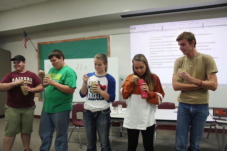 During the November meeting, Tyler Chandler, Daniel Hafner, Kaitlyn Bell, Emily Skaggs and Justin Leavitt participate in the Hungry Man Challenge. The students ate a full Thanksgiving meal blended in a cup. “It was the grossest thing I’ve ever eaten,” Leavitt said. “I probably wouldn’t eat it again.