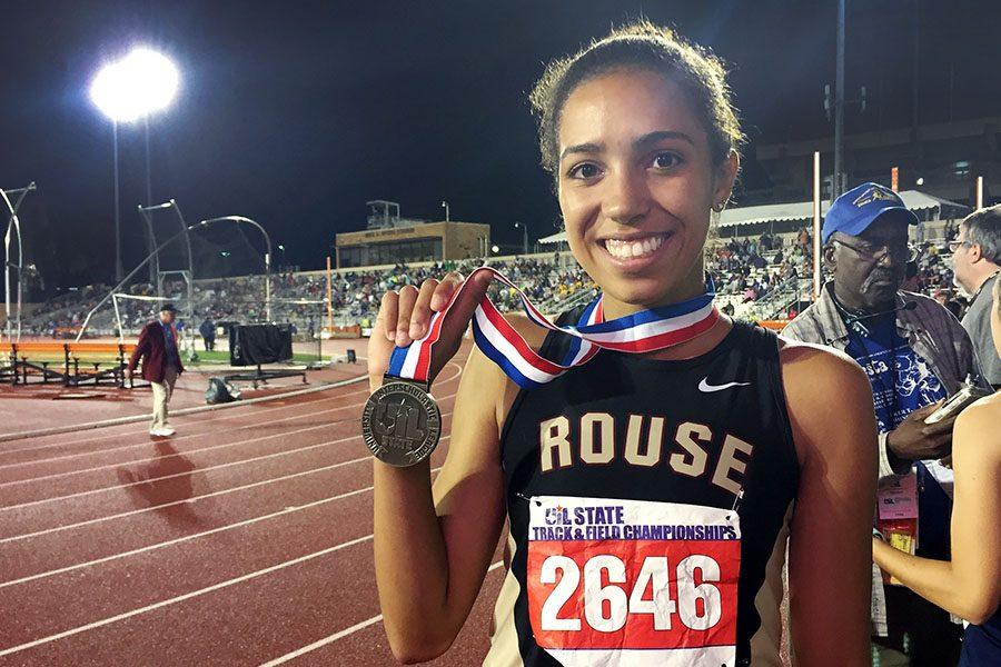 Senior Madie Boreman shows off her silver medal from the 1600 at the 6A state track meet.