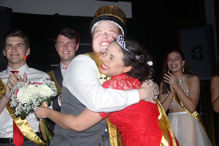 Seniors+Cole+Shuffield+and+Angela+Schiff+hug+after+winning+prom+and+queen.+