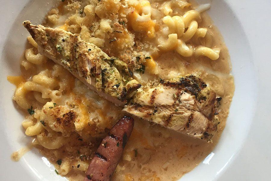The macaroni and cheese included chicken and sausage.