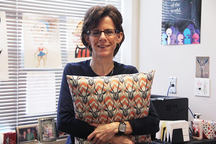 English teacher Teresa Gazella makes pillows for her senior students.