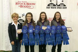 Lemanski and the team show off their ribbons from the Fort Worth show.